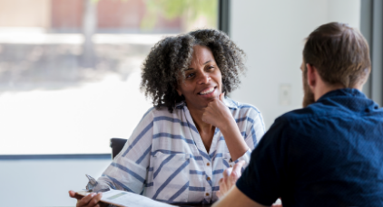 Woman talking to a man
